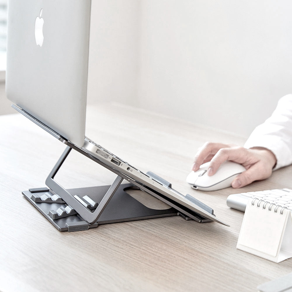 Designed to elevate your laptop or tablet to the optimal viewing angle, this stand ensures comfortable typing and watching while promoting better posture. By reducing eye strain, neck pain, back pain, and wrist discomfort, it enhances your overall work experience. The sturdy aluminum panel keeps your laptop stable and secure, preventing unwanted movement when typing, connecting cables, or using USB ports. 